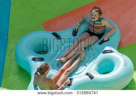 Orlando, Florida. July 29, 2019. People Enjoying Kare Kare Curl Water Attraction At Aquatica 11
