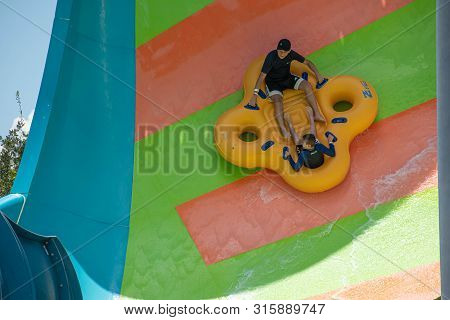 Orlando, Florida. July 29, 2019. People Enjoying Kare Kare Curl Water Attraction At Aquatica 12