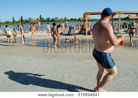 People Bathe In A Salt Lake At A Balneological Resort In Slavyansk Near Donetsk, Ukraine, June 15, 2