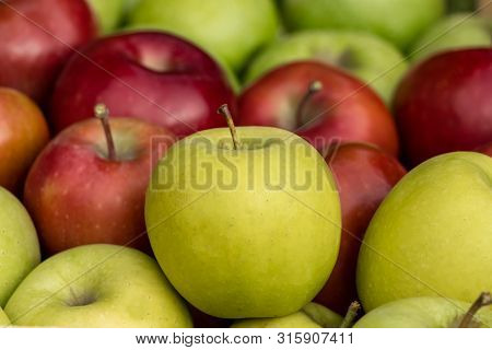 Close Up Of Fresh Golden, Red And Green Apples