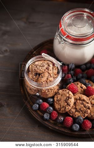 Top View Of Healthy And Delicious Chocolate Biscuits With Fresh Bluebarries
