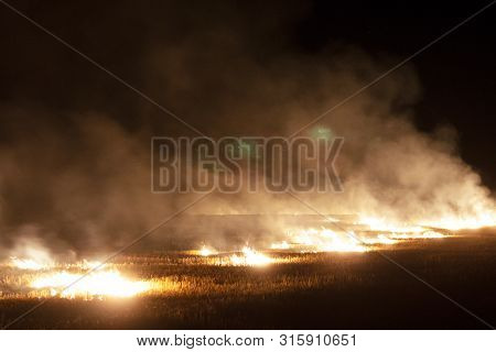 Big Fire And A Lot Of Thick Smoke. Fire At Night