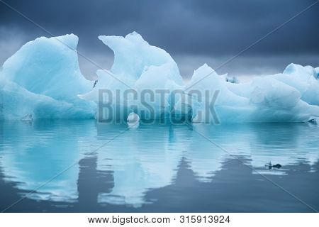 Icebergs In The Skaftafell National Park, Iceland. Ocean Bay And Icebergs. Reflection On The Water S