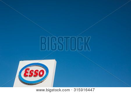 Lyon, France - February 26, 2019: Esso Logo On Its Gas Service Station In Lyon, France On Blue Sky B