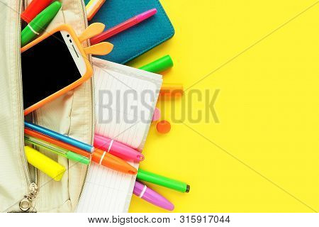 An Opened School Bag (briefcase) And Stationery, Pens, Notebooks, Plasticine, Felt-tip Pens And A Te