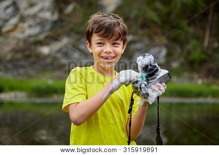 The Bully Ruined Him Fathers Camera By Wetting It. A Cheerful Child Ruined The Camera Of His Parents