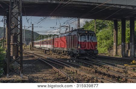Red Slovakia Train In Kysak Station In East Slovakia In Summer Morning