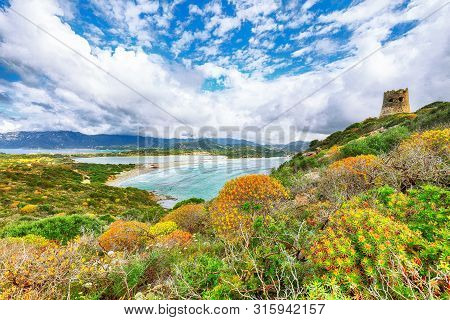 Fantastic View On Lagoon Of Porto Giunco With Turquoise Water And Old Tower. Location: Villasimius, 