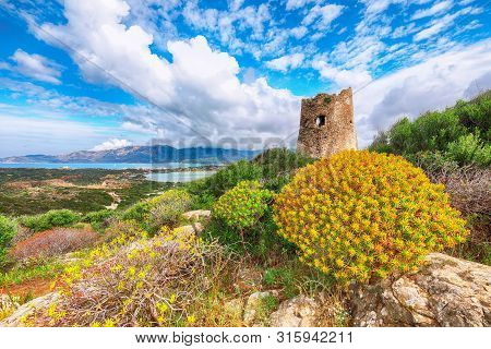 Fantastic View On Lagoon Of Porto Giunco With Turquoise Water And Old Tower. Location: Villasimius, 