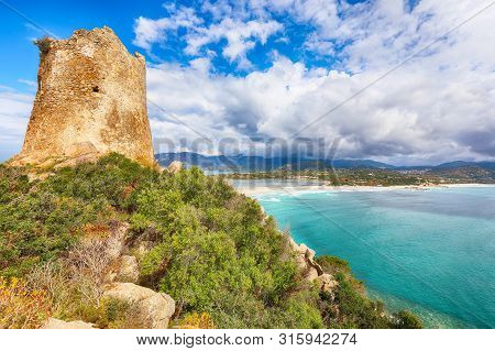 Fantastic View On Lagoon Of Porto Giunco With Turquoise Water And Old Tower. Location: Villasimius, 