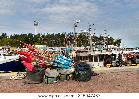 Ustka, Pomeranian / Poland - August 7, 2019: View Of The Fishing Port On The Baltic Sea. Harbor Buil