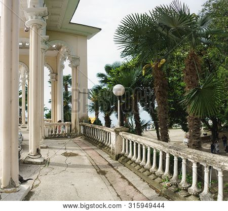 Gagra, Abkhazia - 02 May 2019: Old Balustrade Colonnade On Ardzinba Avenue. Popular Tourist Attracti