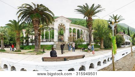 Gagra, Abkhazia - 02 May 2019: View Of The Colonnade On Ardzinba Avenue From The Beach. Popular Tour