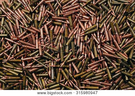 Different Ammo On Wooden Background, Weapon Concept.