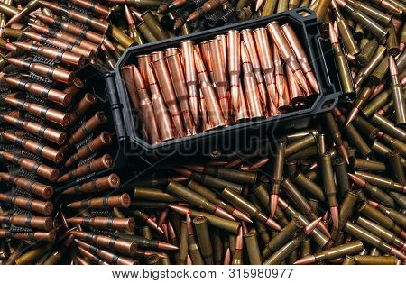 Different Ammo On Wooden Background, Weapon Concept.