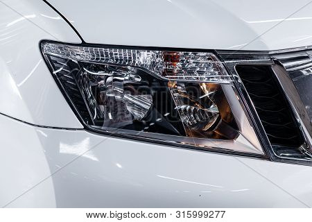 Novosibirsk, Russia - July 17, 2019:  Nissan Terrano, Close-up Of The White Headlight, Bumper Photog