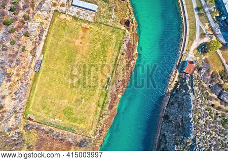 Obrovac. Soccer Field By Zrmanja River Aerial View. Karst Landscape Of Obrovac, Town In Dalmatia Reg