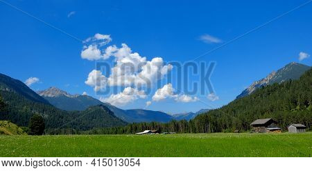 Beautiful Alpine Landscape With Green Meadows, Alpine Cottages And Mountain Peaks, Lechtal, Lech, Au
