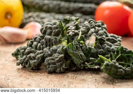 Cooking With Black Flat Leaves Of Cavolo Nero Tuscan Cabbage