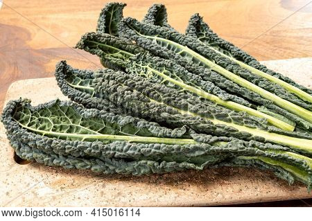 Cooking With Black Flat Leaves Of Cavolo Nero Tuscan Cabbage