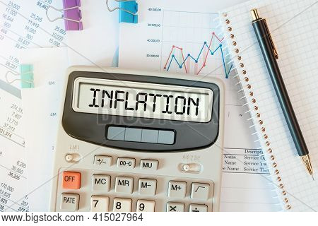 Inflation Word On Calculator. Business And Tax Concept.