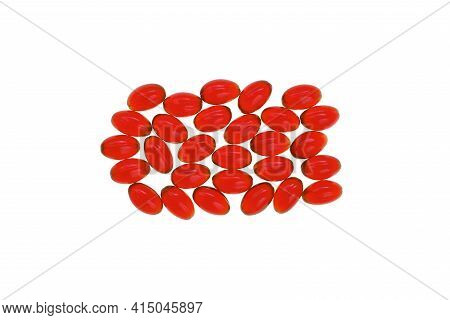 Krill Oil. Red Gelatin Capsules Isolated On White Background.source Of Omega Fatty Acids.healthy Foo