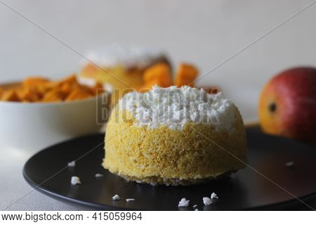 Steamed Ground Rice, Layered With Coconut Shavings And Mango. Locally Known As Mango Puttu. A Tradit