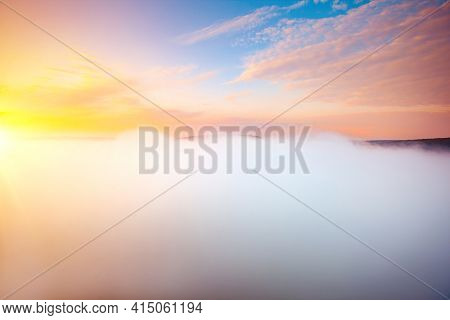 Majestic morning scene of a valley covered with thick fog. Location place Carpathian mountains, Ukraine, Europe. Vibrant photo wallpaper. Spectacular summer picture. Discover the beauty of earth.