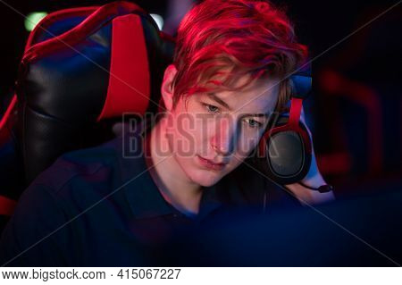 A Cute Gamer Plays An Online Game, Worries About His Teammates, Close-up Portrait