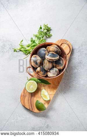 Raw Uncooked Clams Vongole Shells Shellfish With Ingredients For Cooking Coriandr, Beer And Lime In 