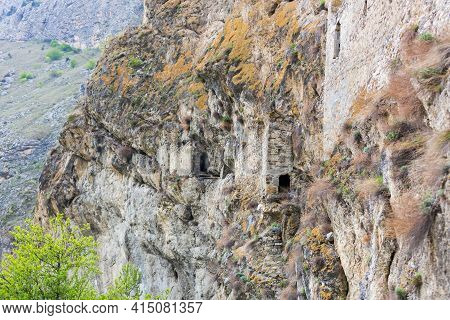 Ancient Dwellings In The Mountains. Kurtat Gorge In North Ossetia-alania, Russia. Stone Cave Houses 