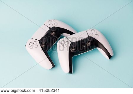 Videogame Console Wireless Gamepad. Blue Background. Minimal Style. Modern Leisure At Home. Couple G