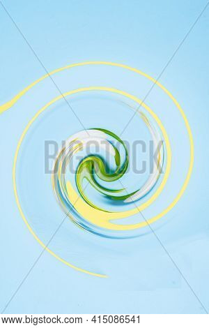 Abstract Background Of Dancing Light Spring Shades. Yellow-green-white Whirlwind On A Blue Backgroun
