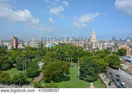 HAVANA, CUBA - JULY 24, 2016: Havana City seen from the Iberostar Parque Central Hotel. in the foreground is Parque Central looking towards Gran Teatro.