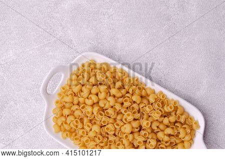Traditional Dry Pasta On A Light Gray Background. Design Concept. A Copy Of The Space. Selective Foc