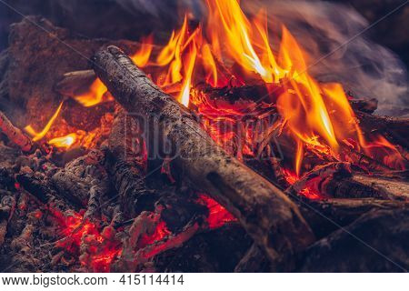 Camping Fire Cozy Closeup View. Outdoor Wildlife Lifestyle. Woods Burning In Flames Stock Photo