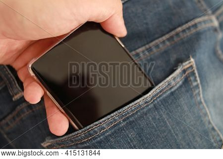 Mobile Phone In Blue Denim Jeans Pant Pocket, Pocketing Smartphone Concept