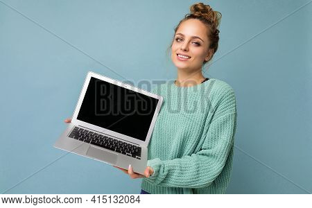 Close-up Portrait Photo Of Beautiful Amiling Dark Blond Young Woman With Gathered Curly Hair Looking