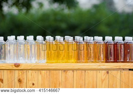 Fresh Natural Drinks In Plastic Bottles On Street Food Festival, Plastic Threat To The Environment, 