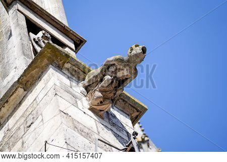 Lime Sandstone Gargoyles At St. Peter\'s Cathedral In Regensburg, Photographed In Spring