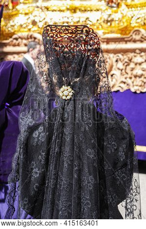 Woman Dressed In Mantilla During A Procession Of Holy Week, Spain