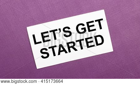 On A Lilac Background, A White Card With The Words Let Is Get Started