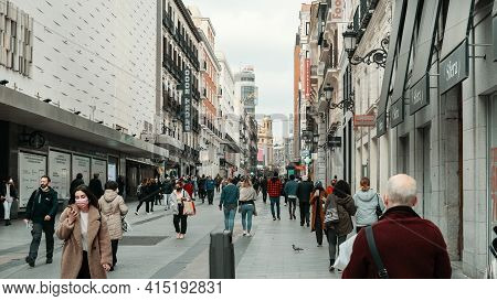 Madrid, Spain - March 5, 2021: Busy Street Of Calle Preciados. Crowd Of People In Face Masks Due Cor