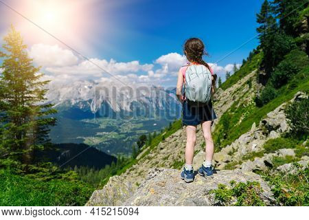 Children Hiking On Beautiful Summer Day In Alps Mountains Austria, Resting On Rock And Admire Amazin
