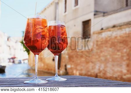 Two Glasses Of Spritz Veneziano Cocktail Served Near The Venetian Canal.
