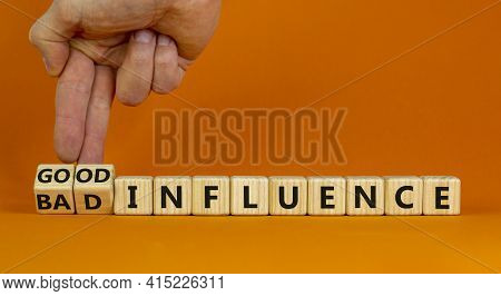 Good Or Bad Influence Symbol. Businessman Turns Cubes And Changes Words 'bad Influence' To 'good Inf