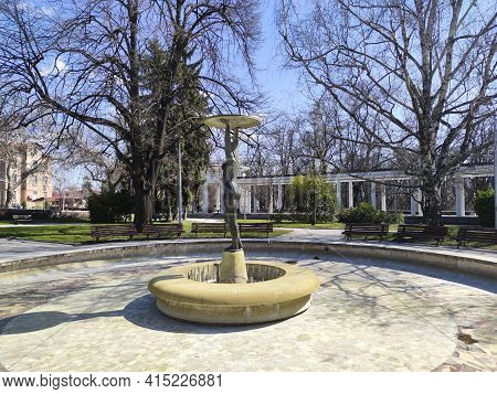 Hisarya, Bulgaria - December 26, 2018:  Fountain With Mineral Water Under Roman Columns In Town Of H