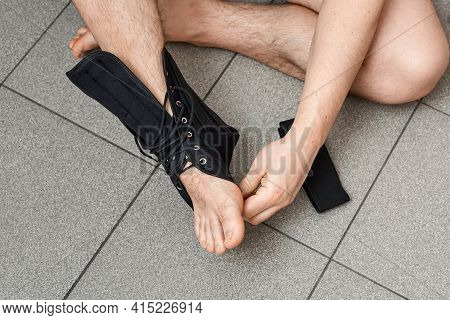The Male Leg Is Fixed In A Medical Bandage. Ankle Fracture Or Sprain. Lacing And Tight Fit Of The Fo