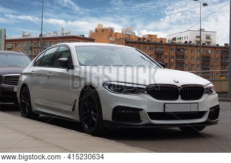 Moscow, Russia - March, 2021: Bmw M5 On The Street In Front Of The Old Brick Houses. White F90 M5 20
