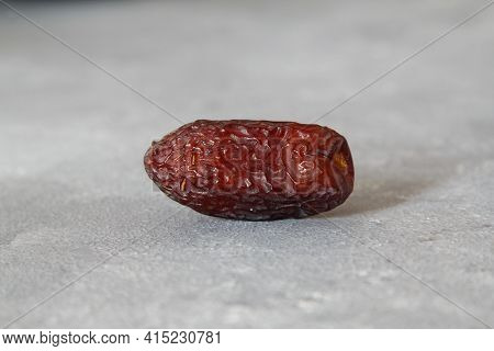 Dates On A Stone Background. Dried Fruits. Dried Dates Lie Next To Each Other